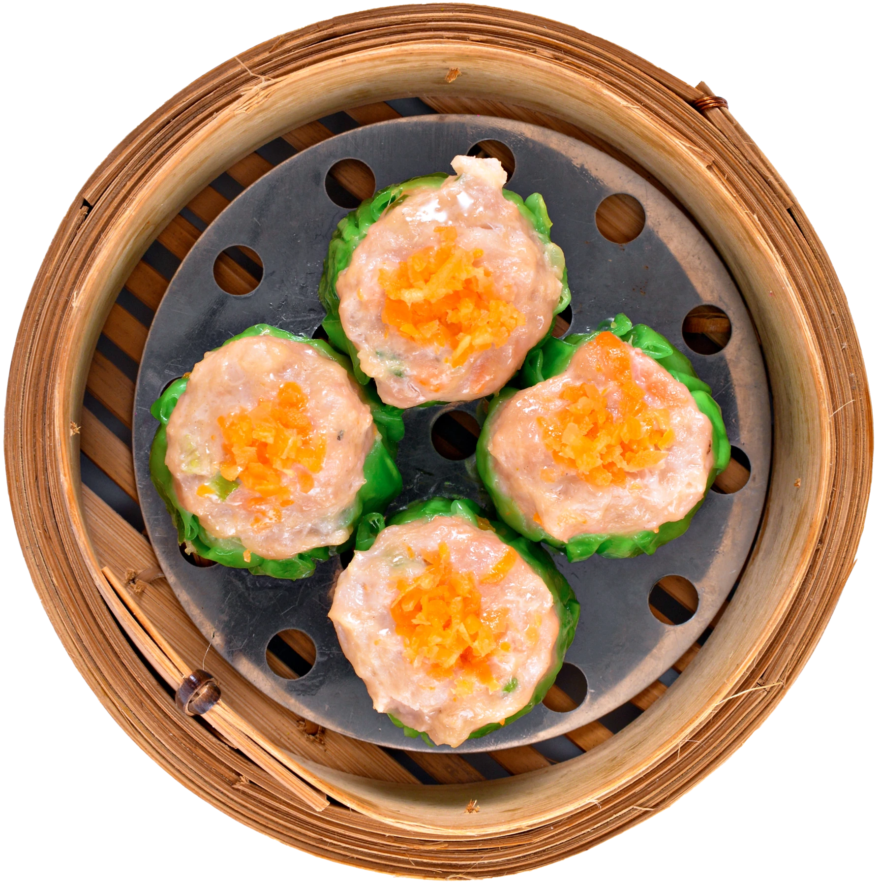 Top view of green chicken dumplings in a bamboo basket at JOY Dim Sum