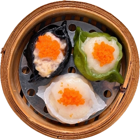 Top view of colourful scallop dumplings in a bamboo basket at JOY Dim Sum